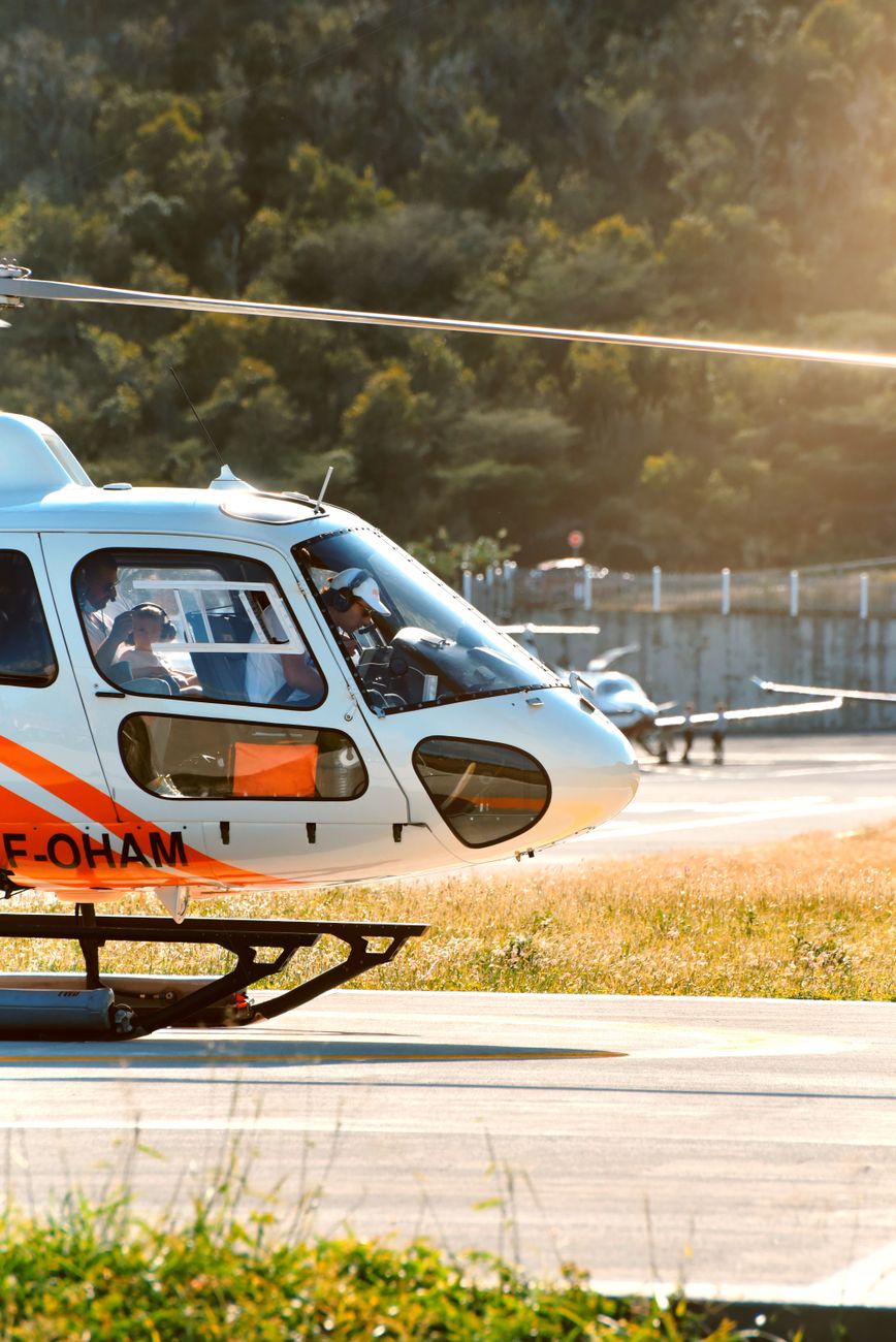 people sitting inside a helicopter on a ground