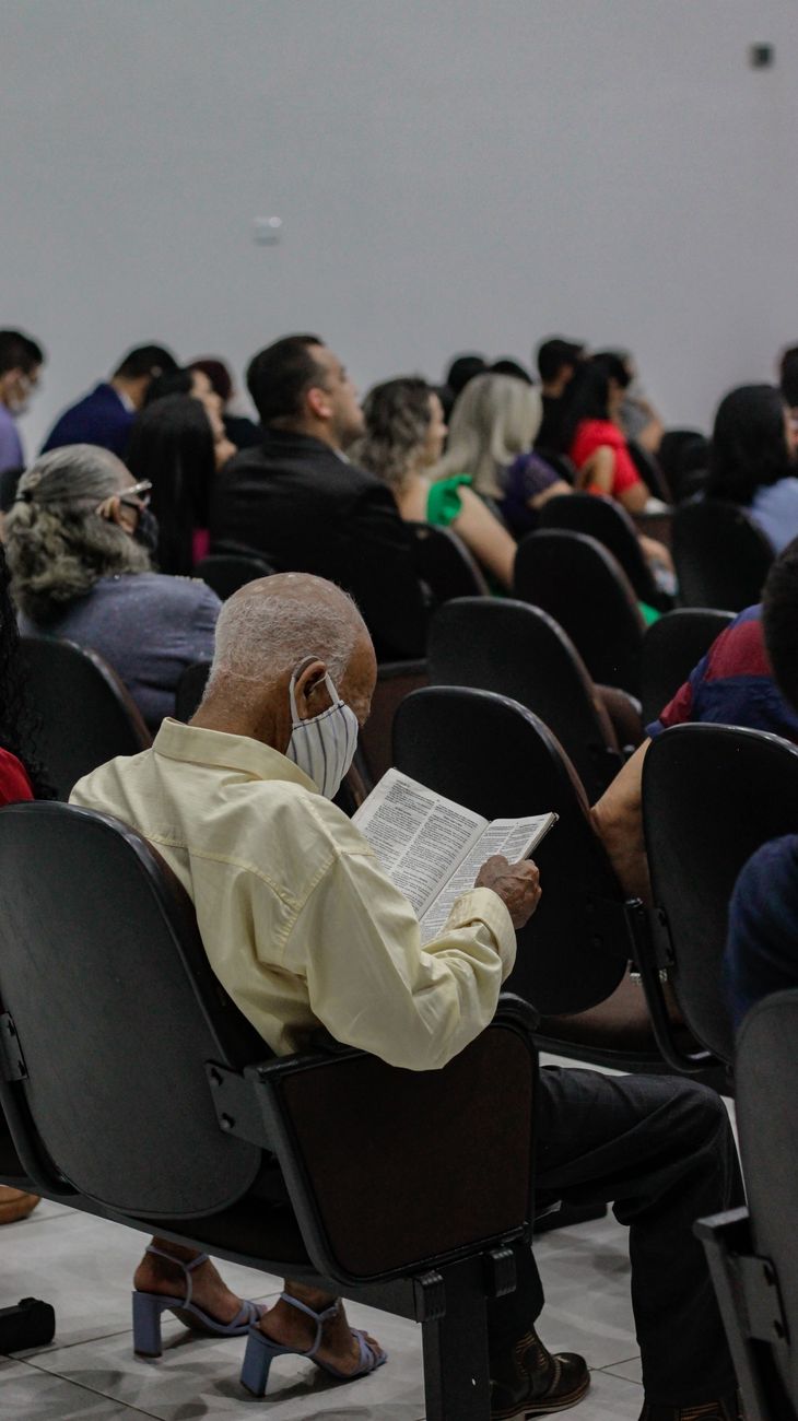 people sitting on black chairs